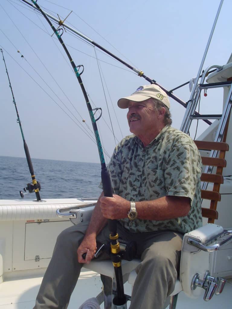 man relaxing while fishing in va beach